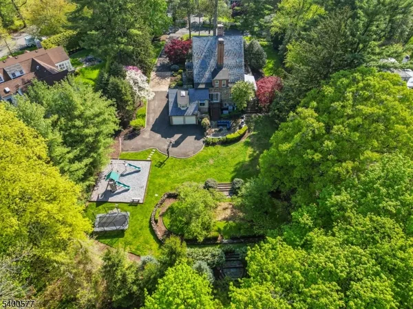 a view of a patio with table and chairs potted plants with a fire pit