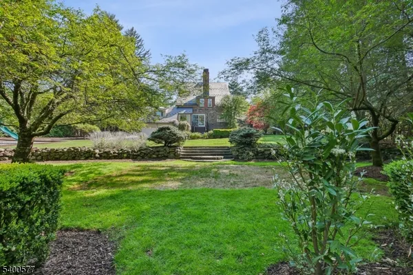 a kitchen with a table chairs stove and cabinets