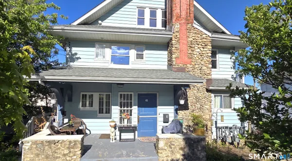 a front view of a house with a porch