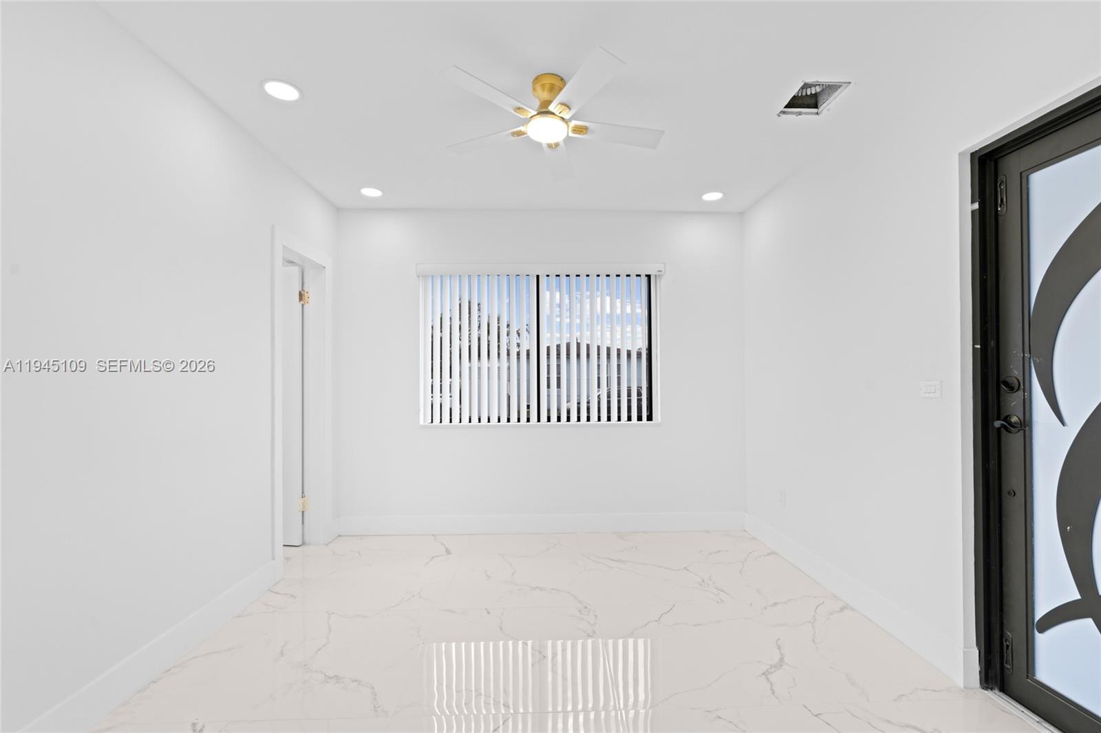 3030 Northwest 99th Street Miami, FL 33147 - Photo 11 of 27 a view of an empty room with a window