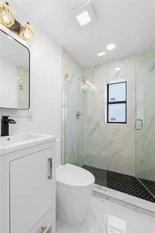 a view of a hallway with a chandelier