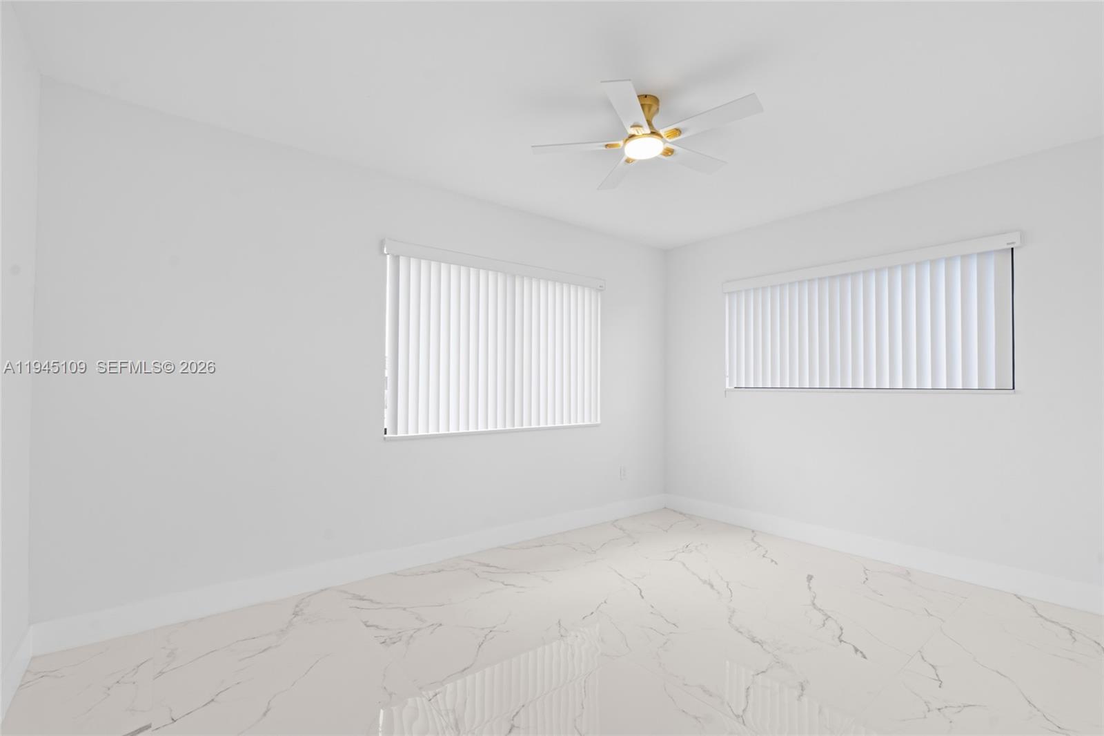 3030 Northwest 99th Street Miami, FL 33147 - Photo 15 of 27 a view of an empty room with a fan