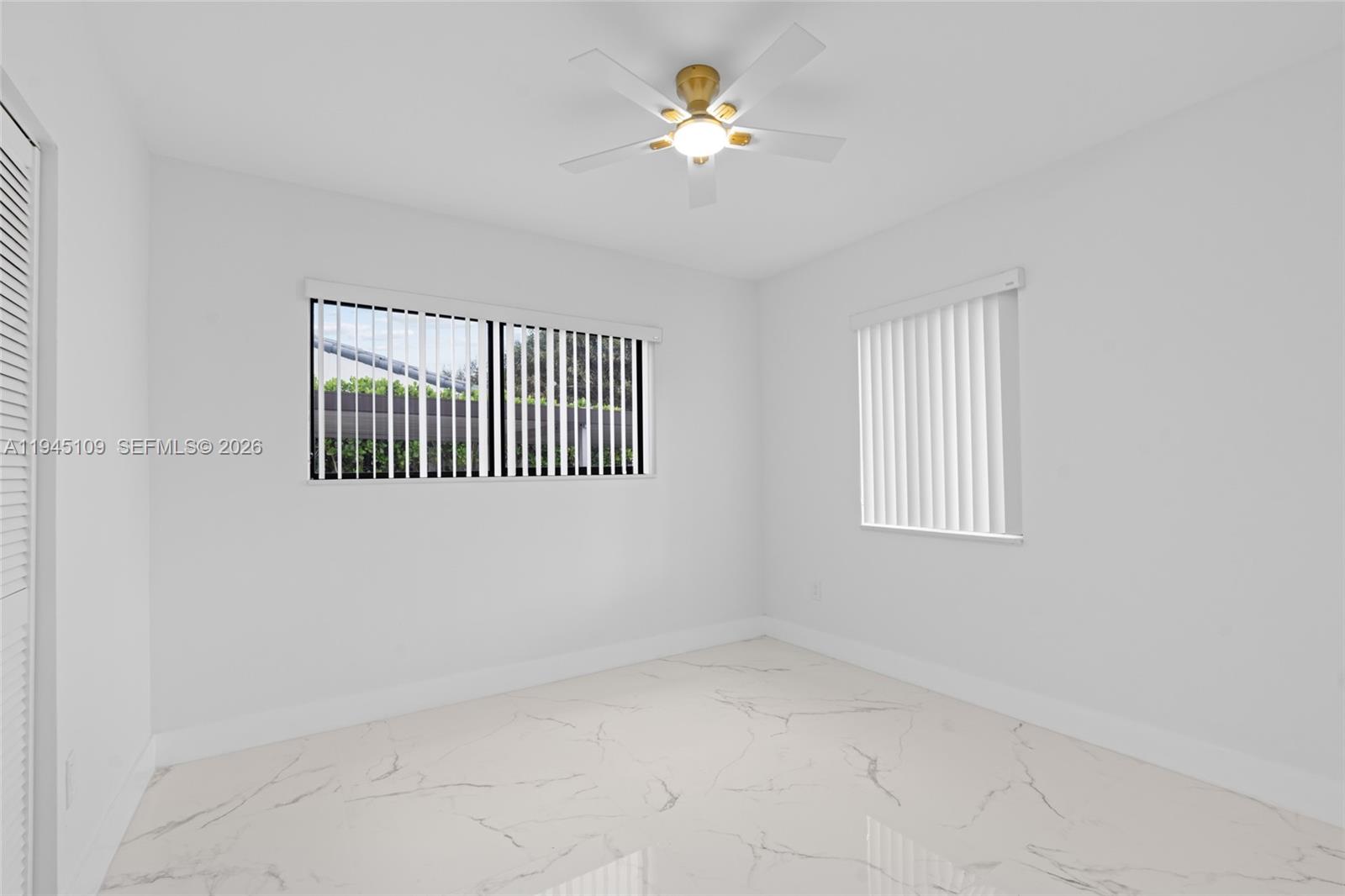 3030 Northwest 99th Street Miami, FL 33147 - Photo 16 of 27 wooden floor in a room with a window