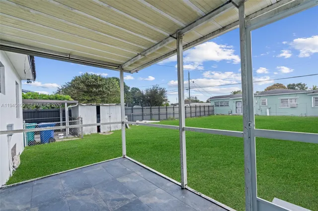a view of an apartment with a garden and entertaining space