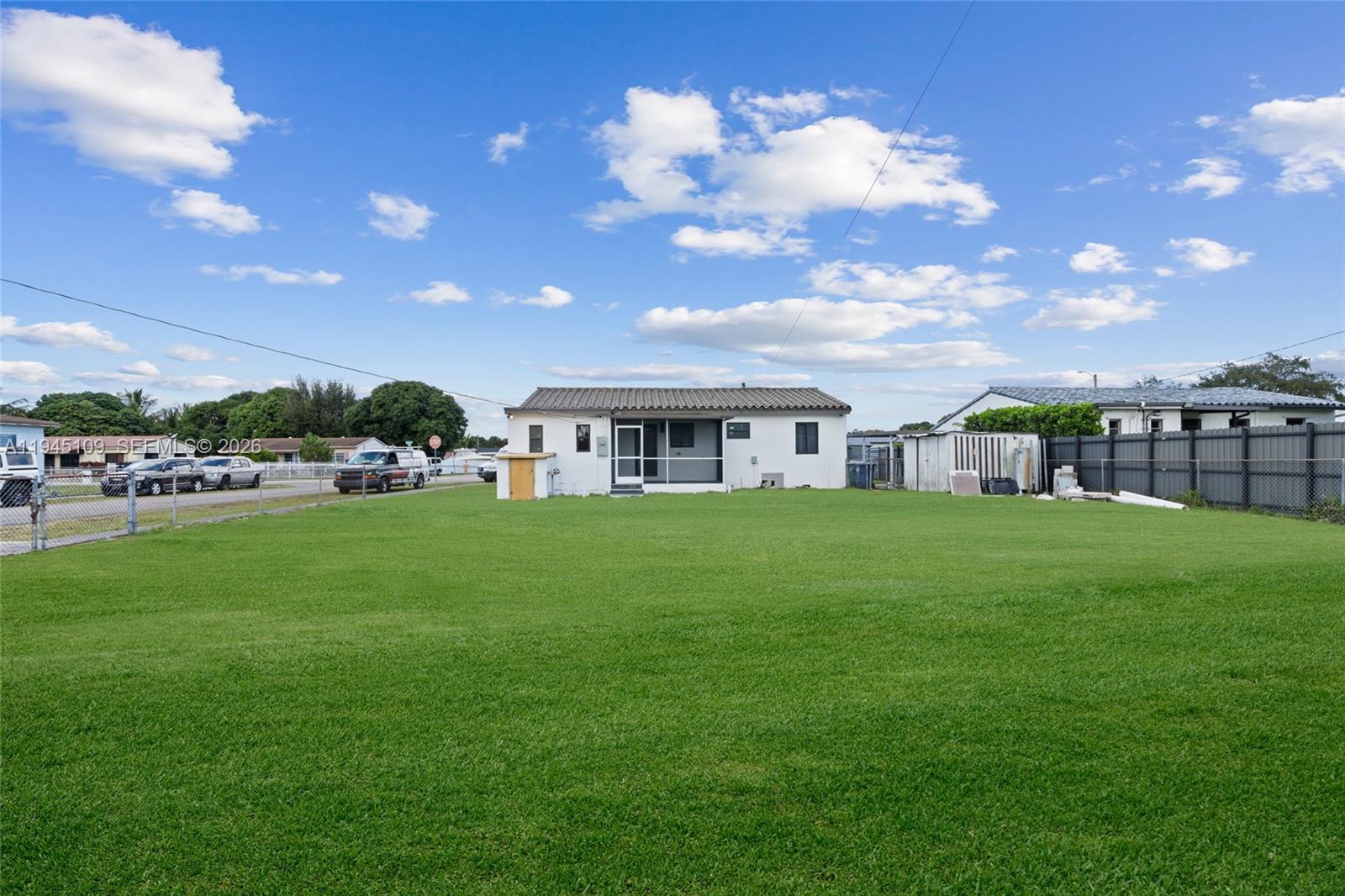 3030 Northwest 99th Street Miami, FL 33147 - Photo 23 of 27 a view of an apartment with a garden and entertaining space