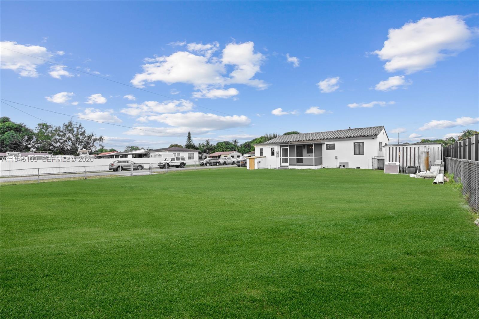3030 Northwest 99th Street Miami, FL 33147 - Photo 24 of 27 a view of a house with a big yard