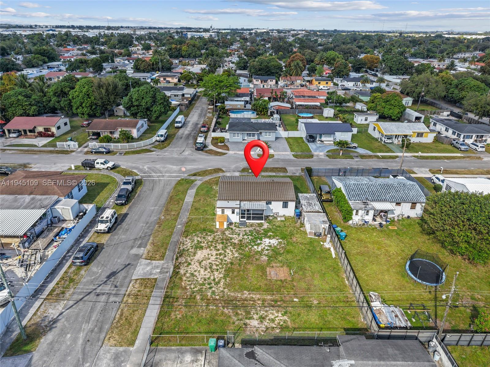 3030 Northwest 99th Street Miami, FL 33147 - Photo 26 of 27 an aerial view of residential houses with outdoor space