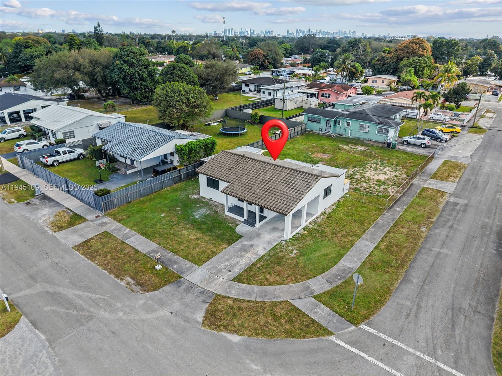3030 Northwest 99th Street Miami, FL 33147 - Photo 27 of 27 an aerial view of a house having yard swimming pool and ocean view