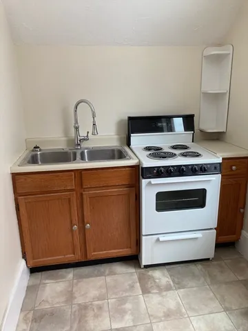 a room with a cabinets and a window