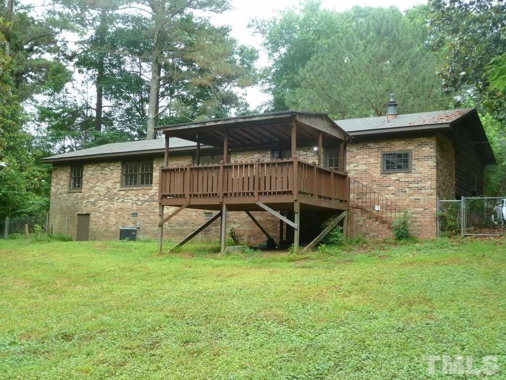 3808 Cole Mill Road Durham, NC 27712 - Photo 14 of 17 This view of the brick home shows the relaxing back deck.