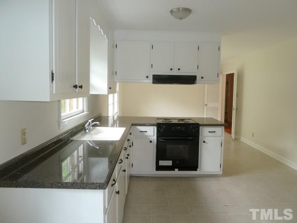3808 Cole Mill Road Durham, NC 27712 - Photo 4 of 17 This nice kitchen features brand new countertops and drop in electric range.
