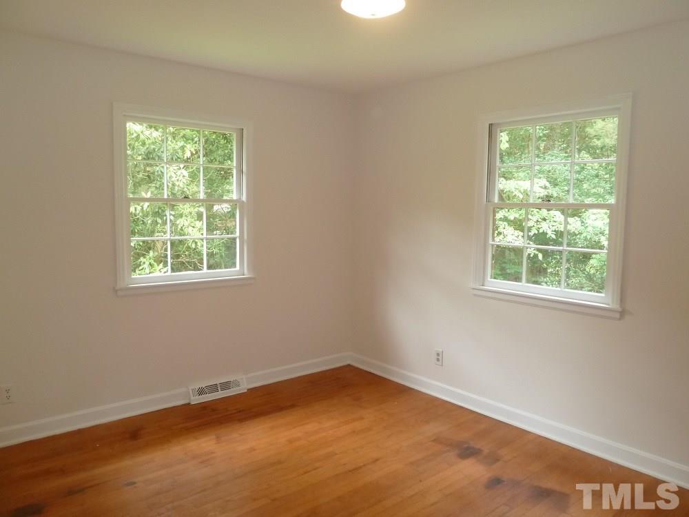 3808 Cole Mill Road Durham, NC 27712 - Photo 10 of 17 One of the two additional bedrooms also with hardwood floors.