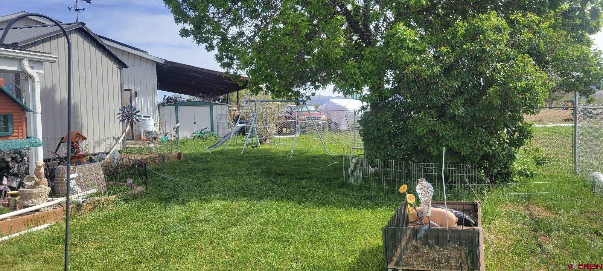 12880 2900th Road Hotchkiss, CO 81419 - Photo 20 of 22 a view of a chair and table in backyard of the house