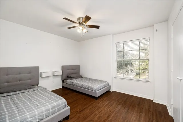 a bedroom with furniture and a window