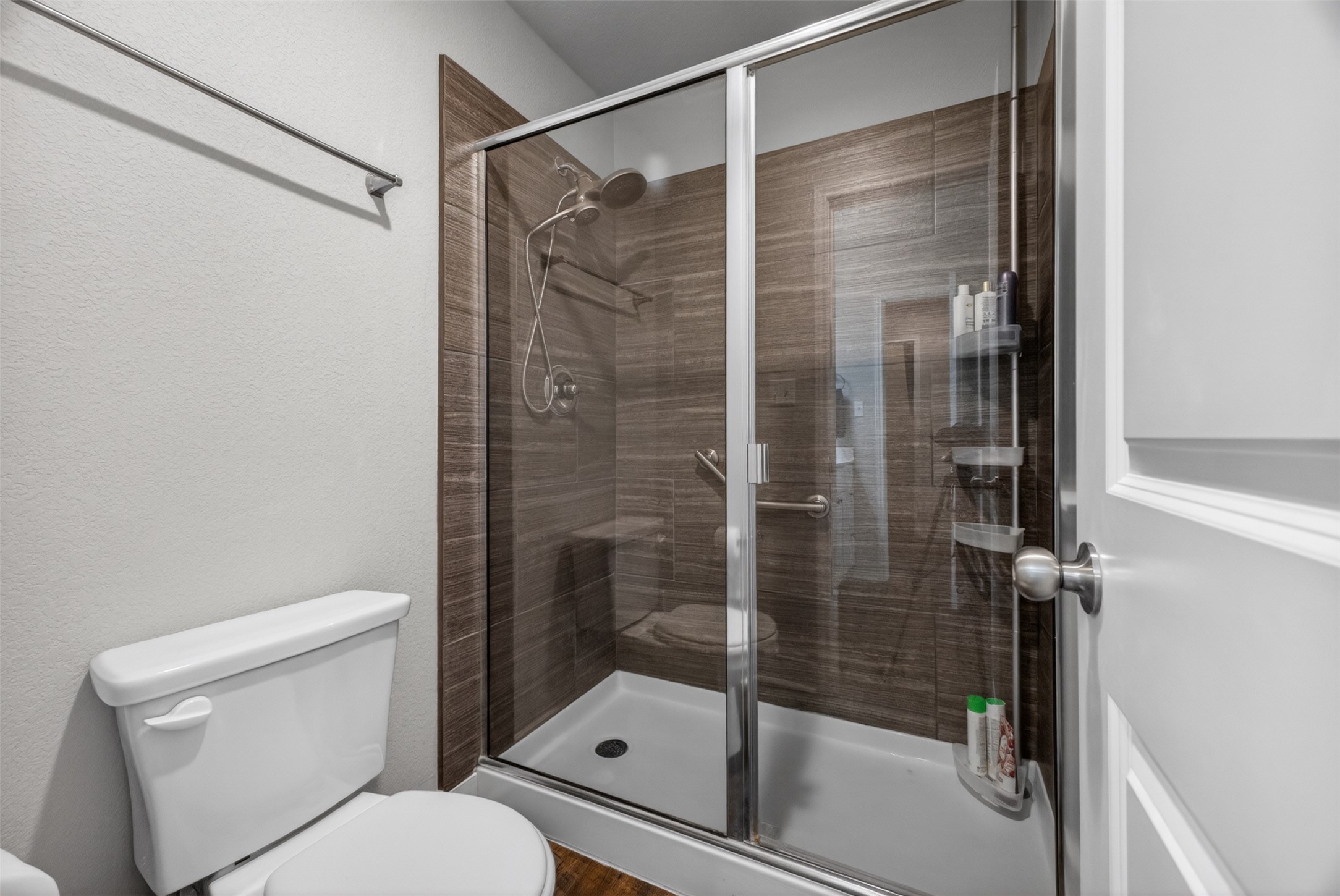 1009 Bright Star Cove Georgetown, TX 78628 - Photo 21 of 40 a bathroom with a shower and toilet