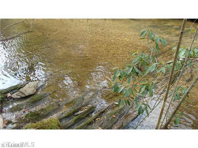 360 Lewis Elkin, NC 28621 - Photo 9 of 11 Waterfront/Dock/Pier. Spend summer playing in your crystal clear creek!!