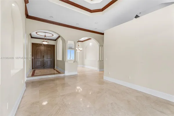 a view of a hallway with an entryway