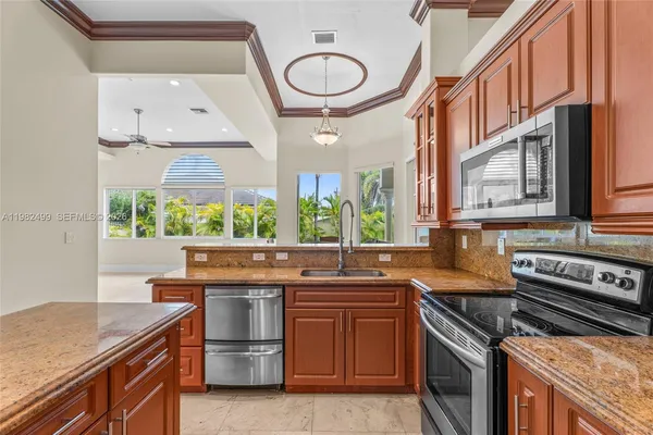 a kitchen with a stove and a sink