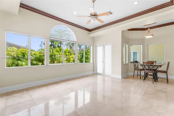 a view of a dining room with furniture window and outside view