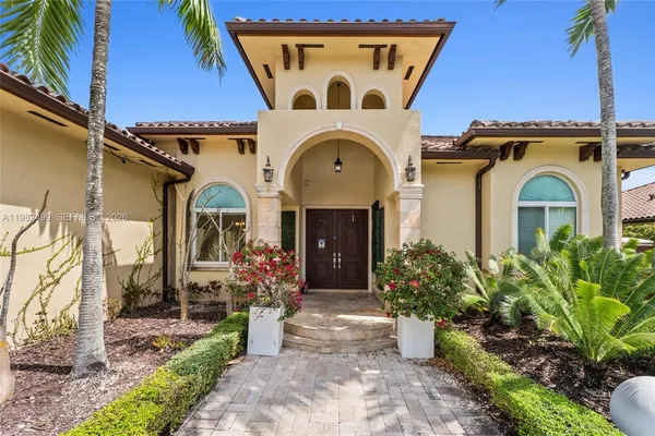 a front view of a house with garden