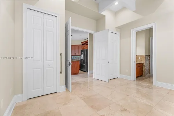 an empty room with closet area