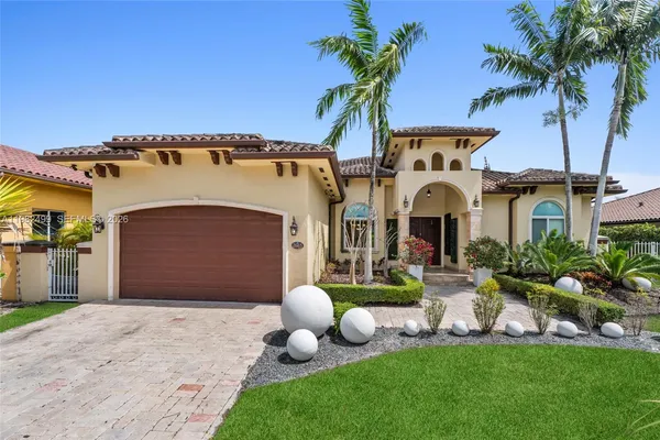 a front view of a house with garden