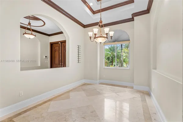 an empty room with windows and entrance