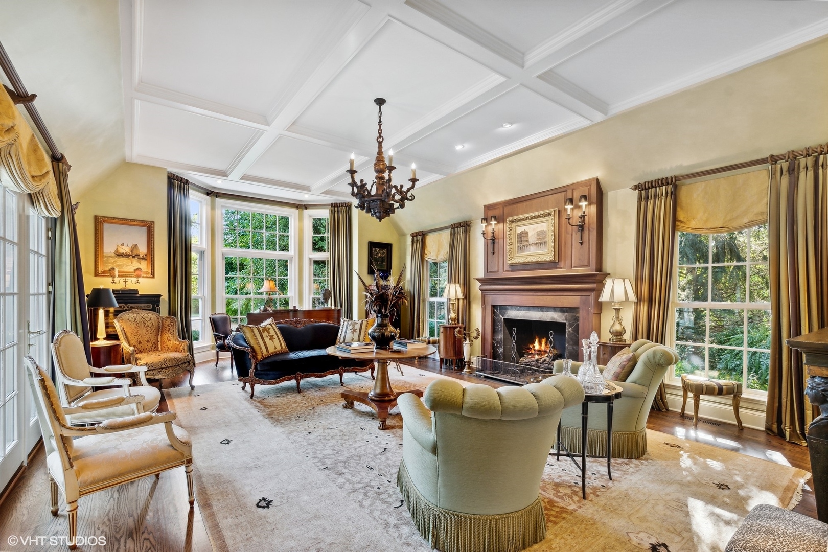 796 East Deerpath Road Lake Forest, IL 60045 - Photo 11 of 60 a living room with furniture a chandelier and a fireplace