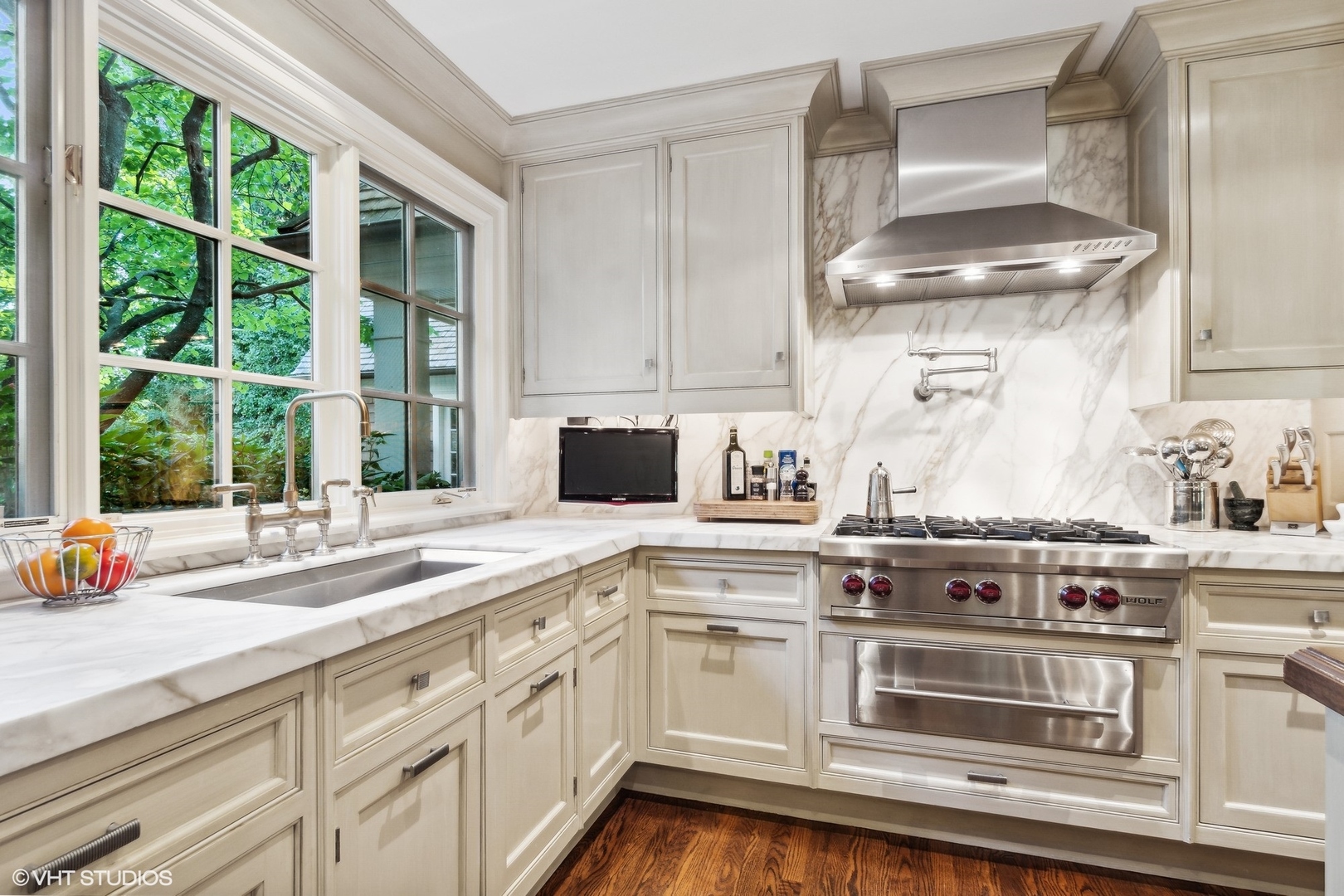 796 East Deerpath Road Lake Forest, IL 60045 - Photo 26 of 60 a kitchen with stainless steel appliances a stove a sink and white cabinets