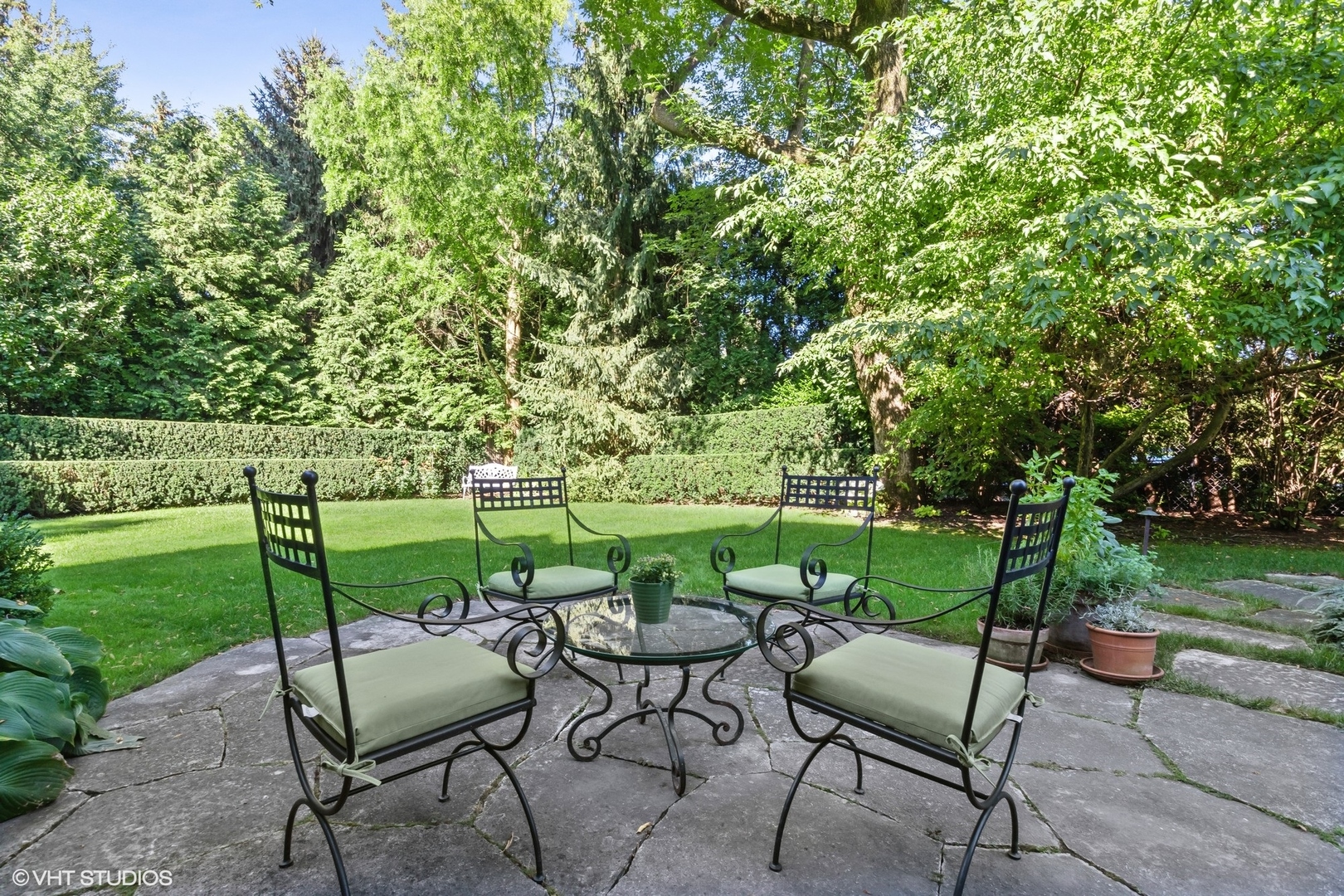 796 East Deerpath Road Lake Forest, IL 60045 - Photo 60 of 60 a view of a table and chairs in the garden