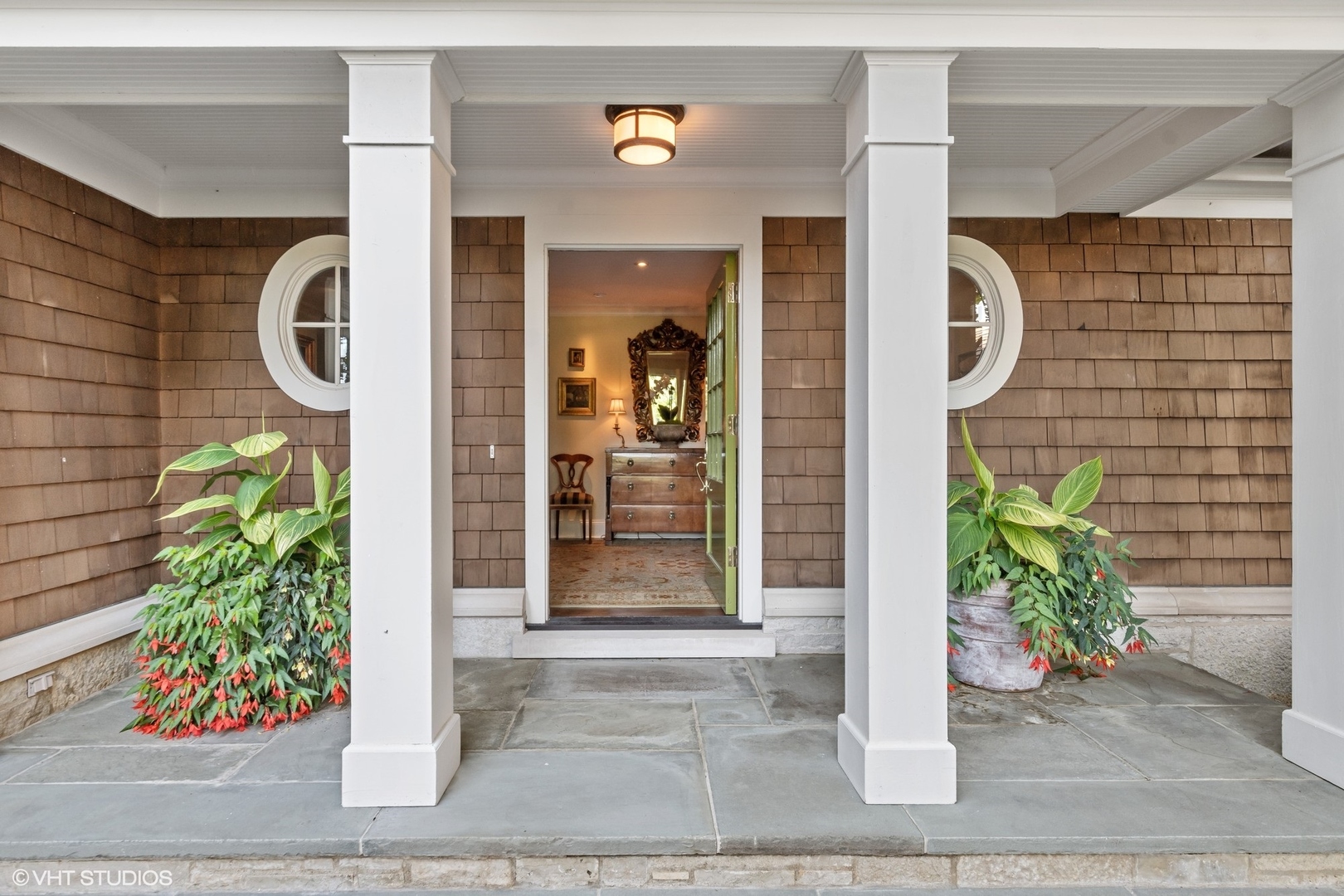 796 East Deerpath Road Lake Forest, IL 60045 - Photo 7 of 60 a front view of a house with a potted plant