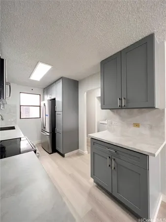 a spacious bathroom with a granite countertop sink and mirror