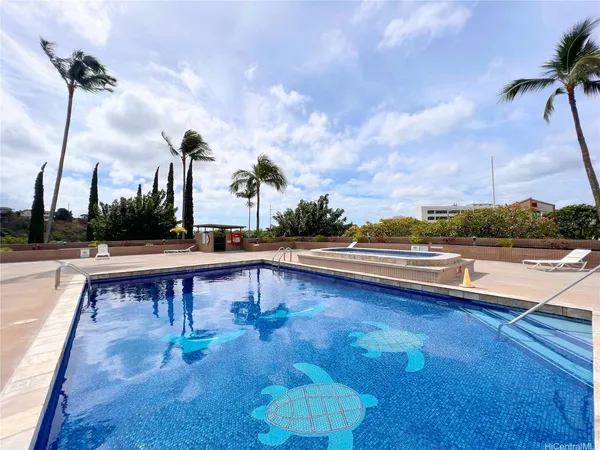 a view of a swimming pool with a patio and a yard