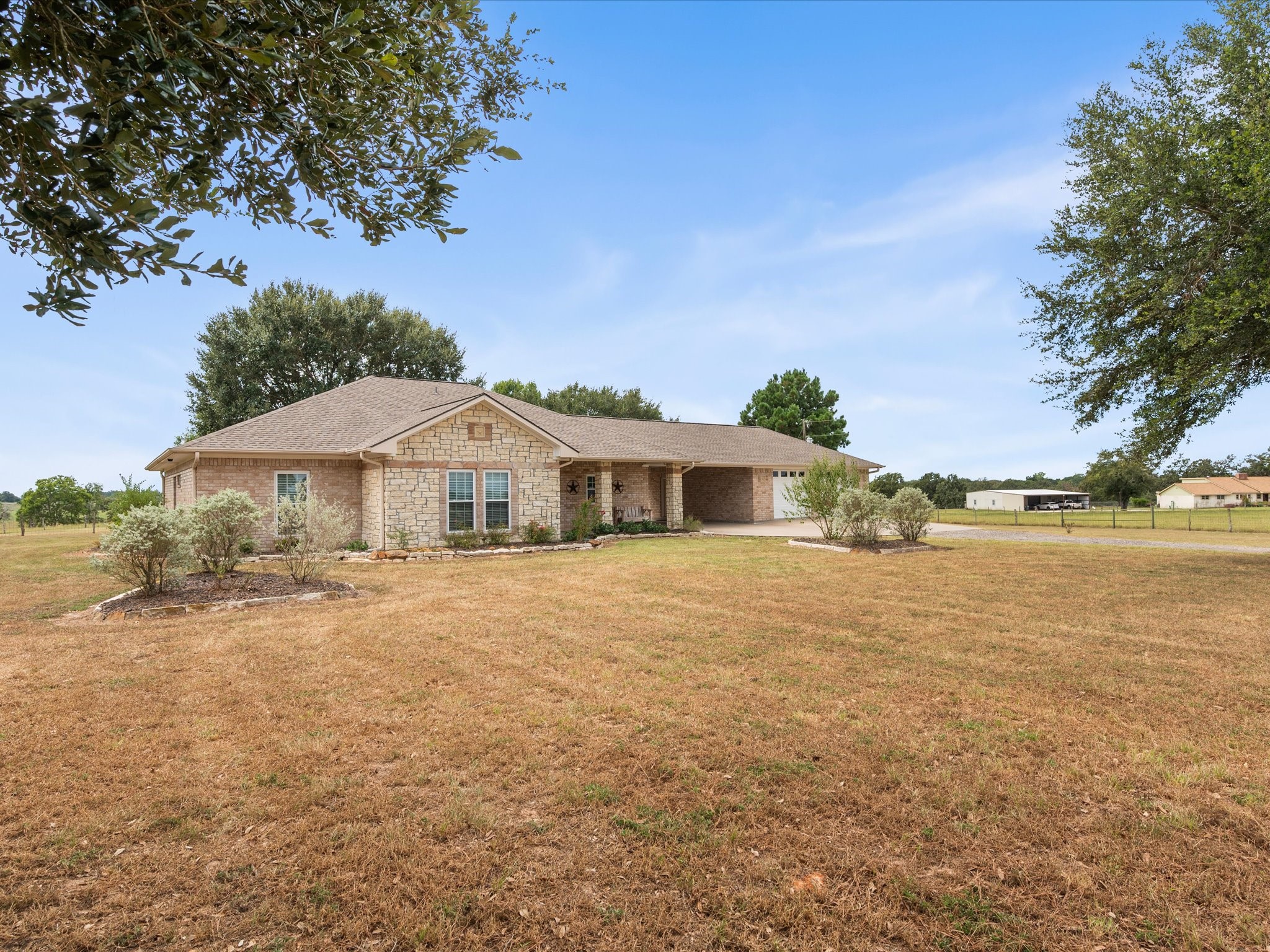 19929 Pierceall Road Hempstead, TX 77445 - Photo 8 of 50 Peaceful acreage and thoughtfully designed improvements create an inviting setting ready for equestrian adventures and country living.