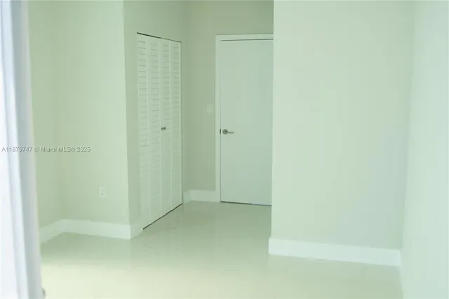 a view of a glass door and a window