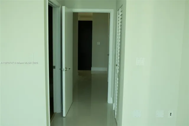 a view of a bathroom from a hallway