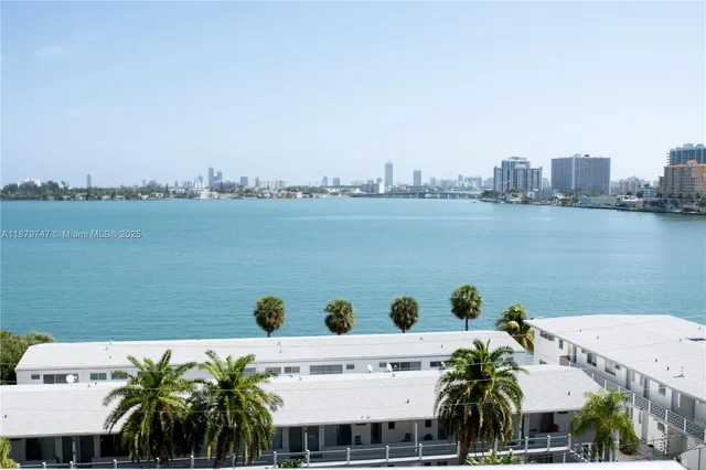 a view of an ocean with a building in the background