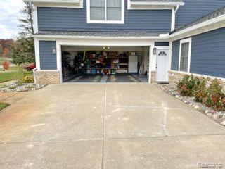 4435 Lily Drive Howell, MI 48843 - Photo 54 of 58 SECOND 2.5 Car garage enters by coat area/1/2 bath
