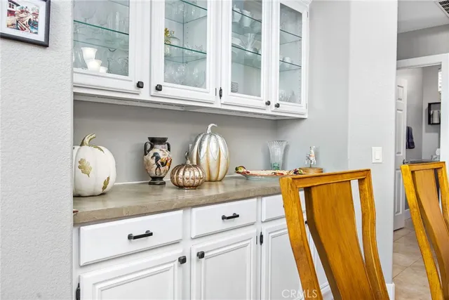 a kitchen with stainless steel appliances granite countertop a sink a stove and cabinets