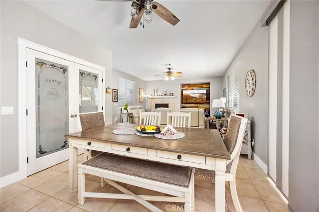 a dining room with furniture and window