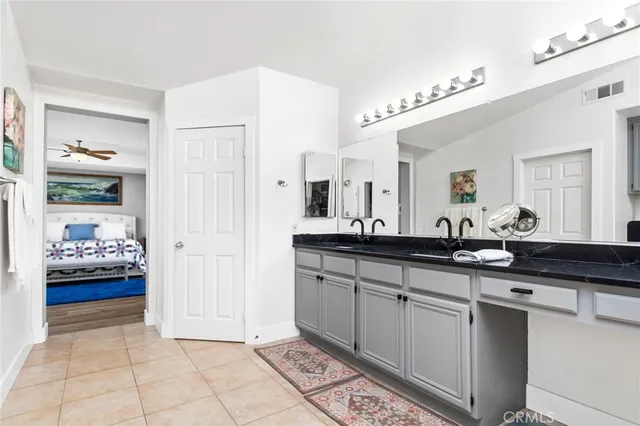 a large bathroom with a sink and a mirror