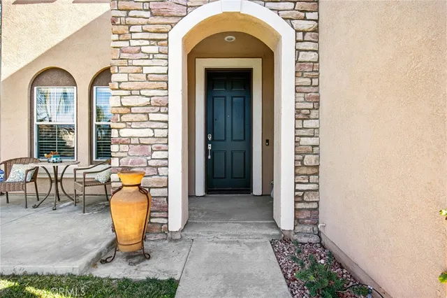 a view of a entryway door front of a house