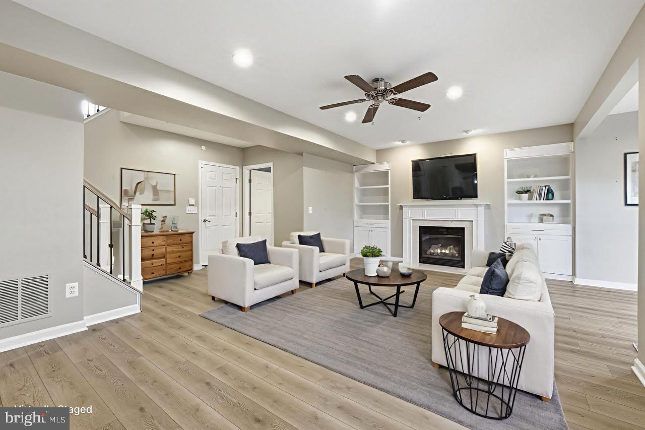 19188 Sweig Terrace Leesburg, VA 20176 - Photo 47 of 58 Cozy gas fireplace with custom built-ins.