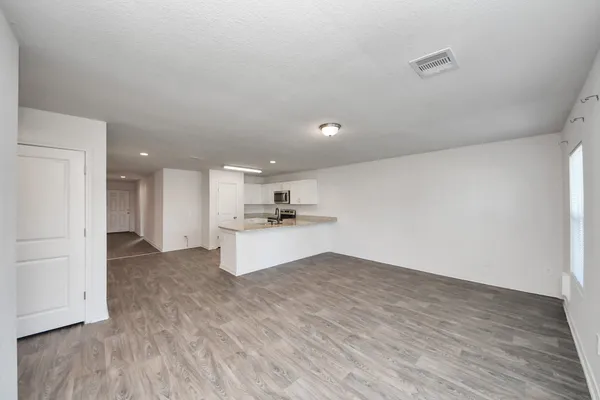 a view of kitchen with wooden floor