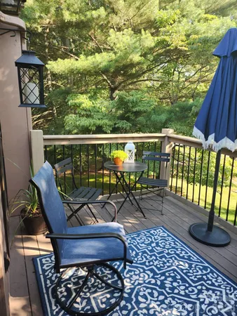 a view of a balcony with chairs