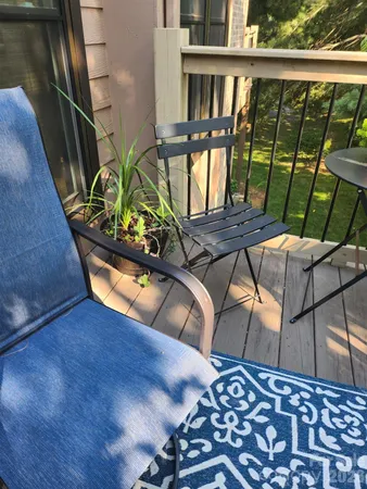 a view of balcony with furniture