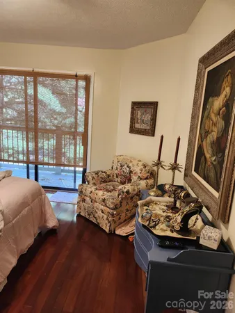 a bed room with two bed and a large window