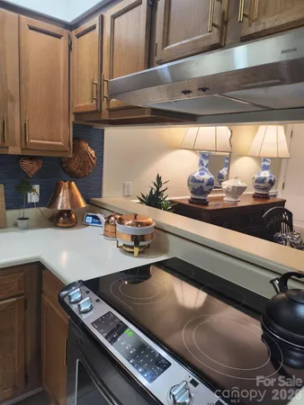 a kitchen with a stove and a sink