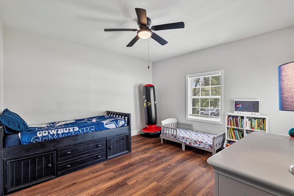 25 West Parnell Street Denison, TX 75020 - Photo 13 of 16 a bedroom with furniture and a window
