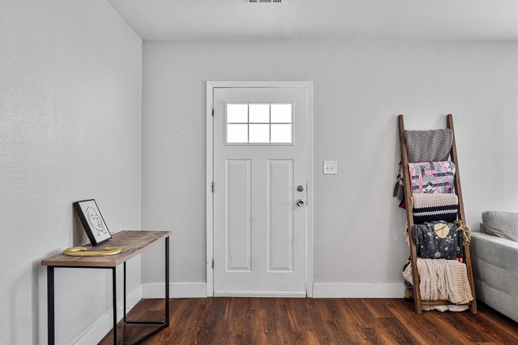 25 West Parnell Street Denison, TX 75020 - Photo 2 of 16 a view of room with furniture and wooden floor